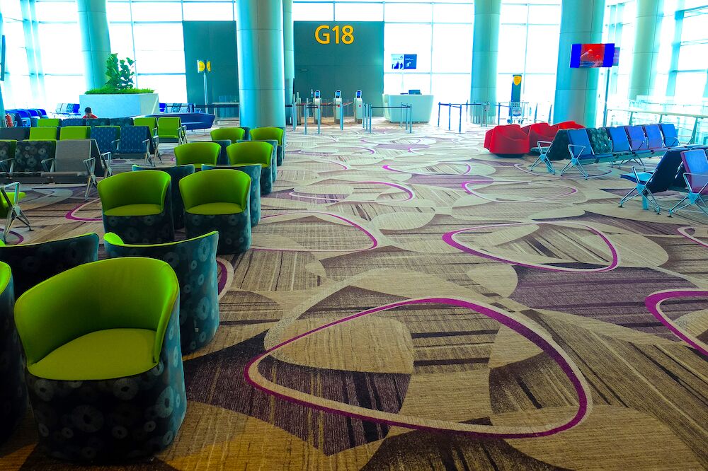 Chairs next to a gate at Singapore Changi Airport