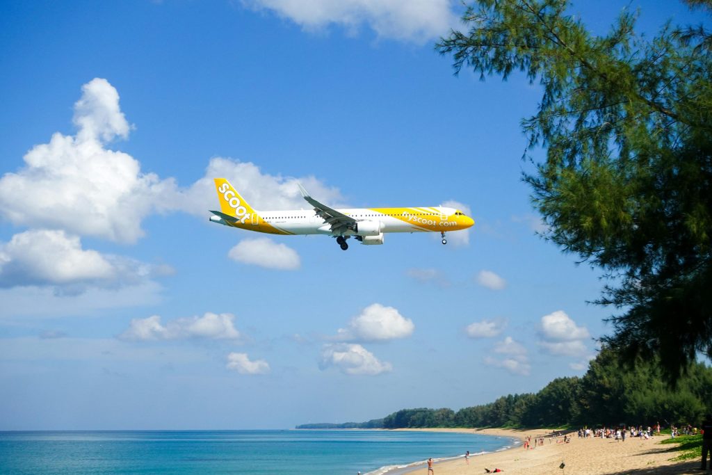 A budget airline plane landing over the sea