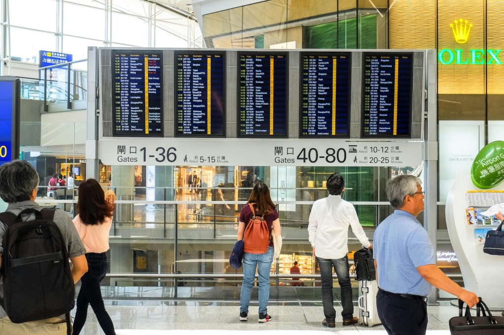 People watching departure boards